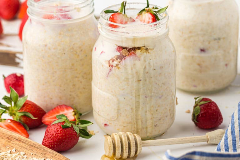 Headon view of strawberry overnight oats in Mason jars.