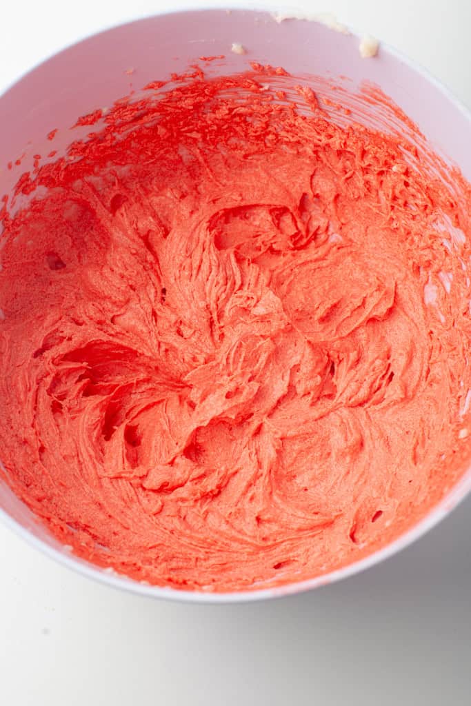 Overhead view of red velvet cupcake batter.