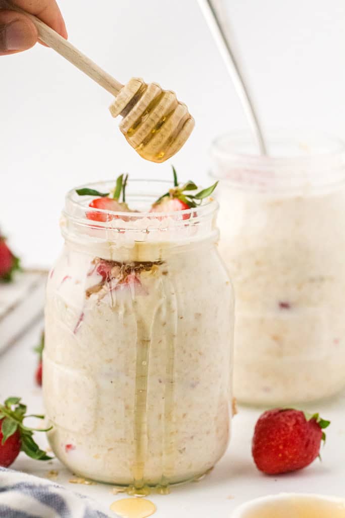 drizzzling honey in overnight oats.