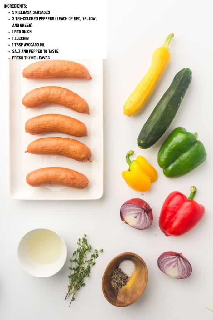 Overhead view of oven-roasted sausage and vegetables ingredients.