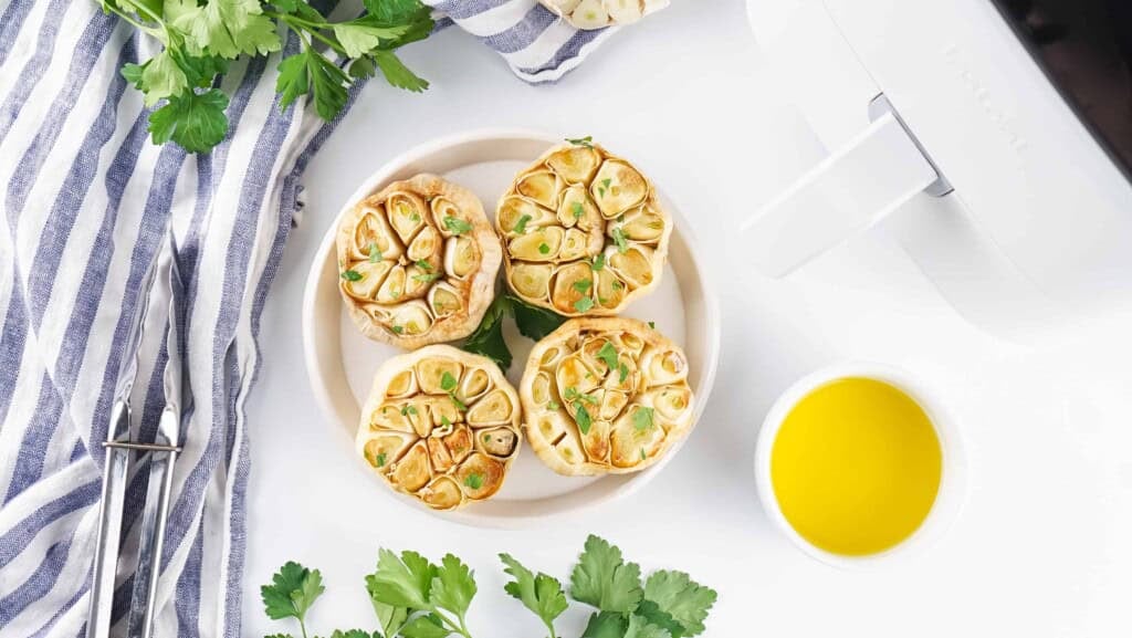 Overhead view of roasted garlic bulbs.