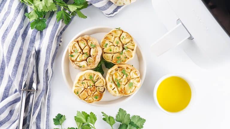 Overhead view of roasted garlic bulbs.