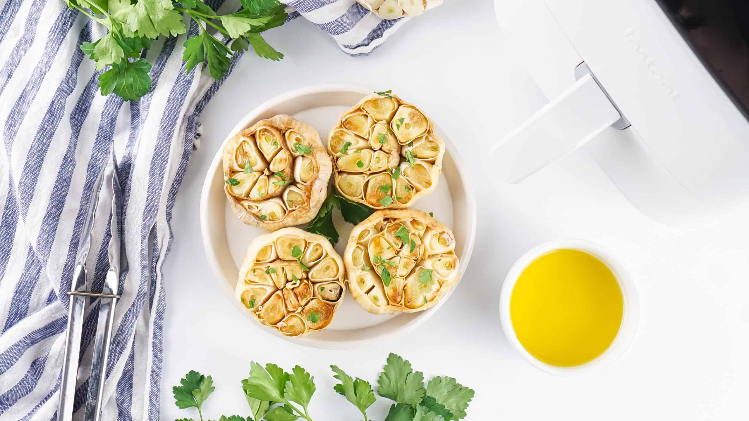 Overhead view of roasted garlic bulbs.