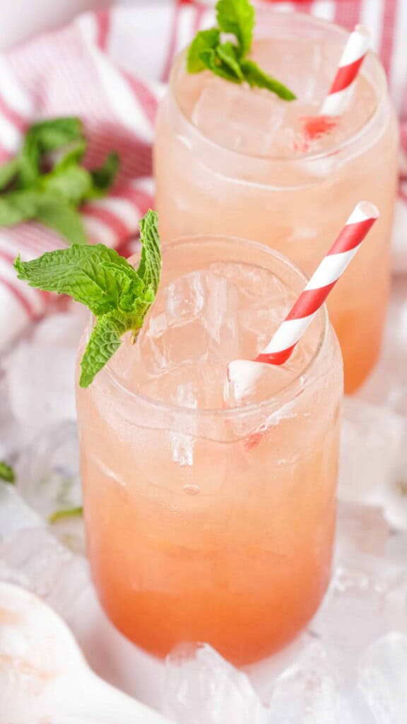 2 glasses of strawberry jam seltzers.