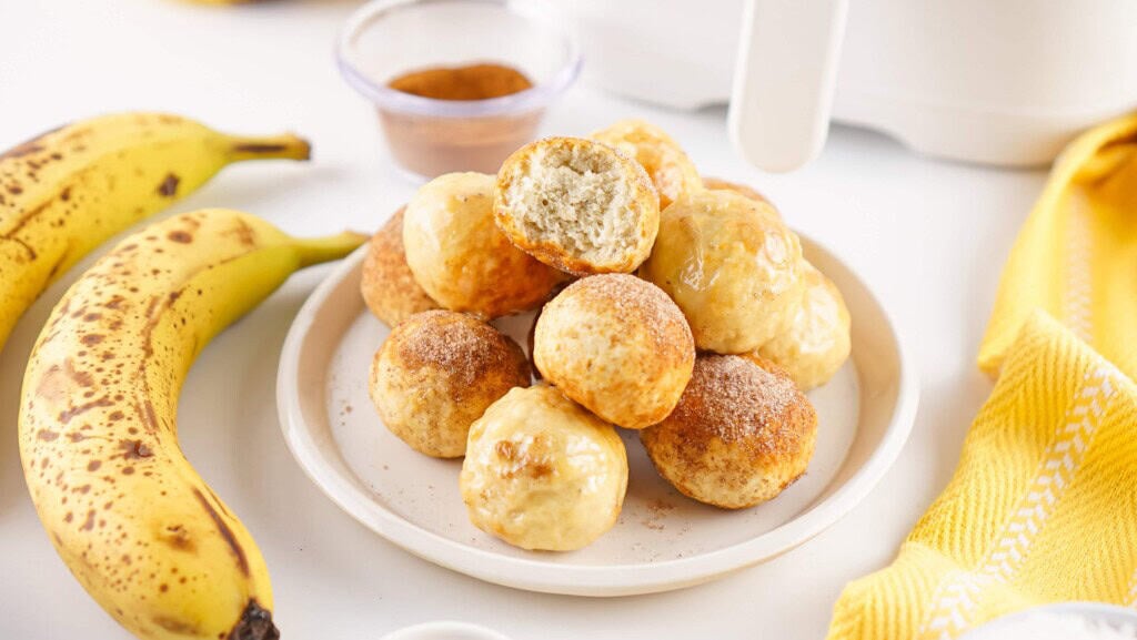 Air Fryer Banana Donut Holes on a white plate.