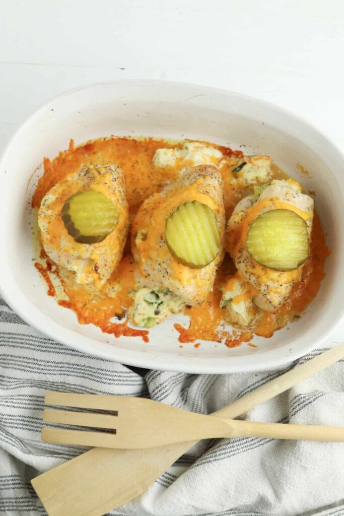 Overhead view of backed pickle chicken in a white casserole dish.