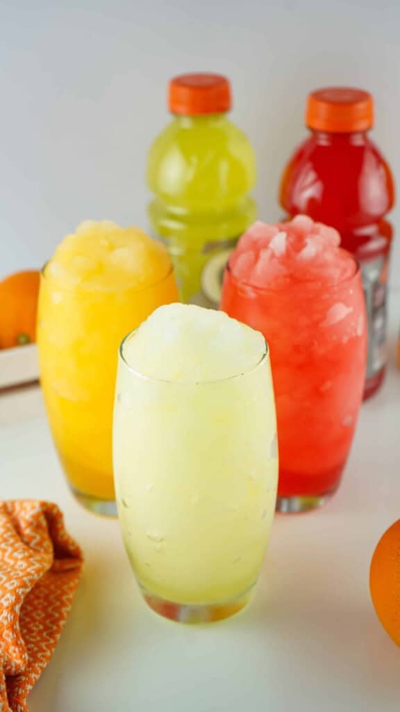 3 glasses of Gatorade slashes in different flavors.