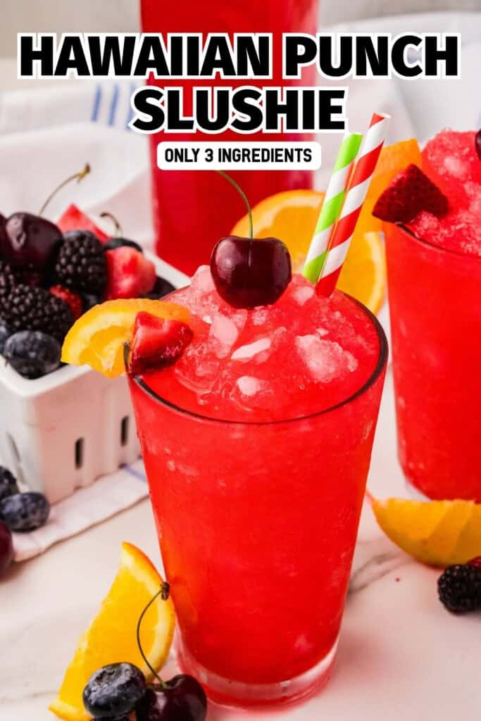 Hawaiian punch slushie in a tall glass with cherry on top