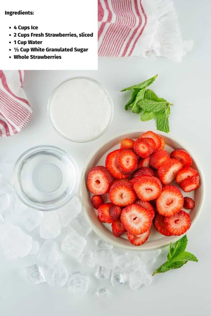 Overhead view of strawberry agua fresca ingredients.