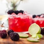Blackberry margarita with lime and blackberries.