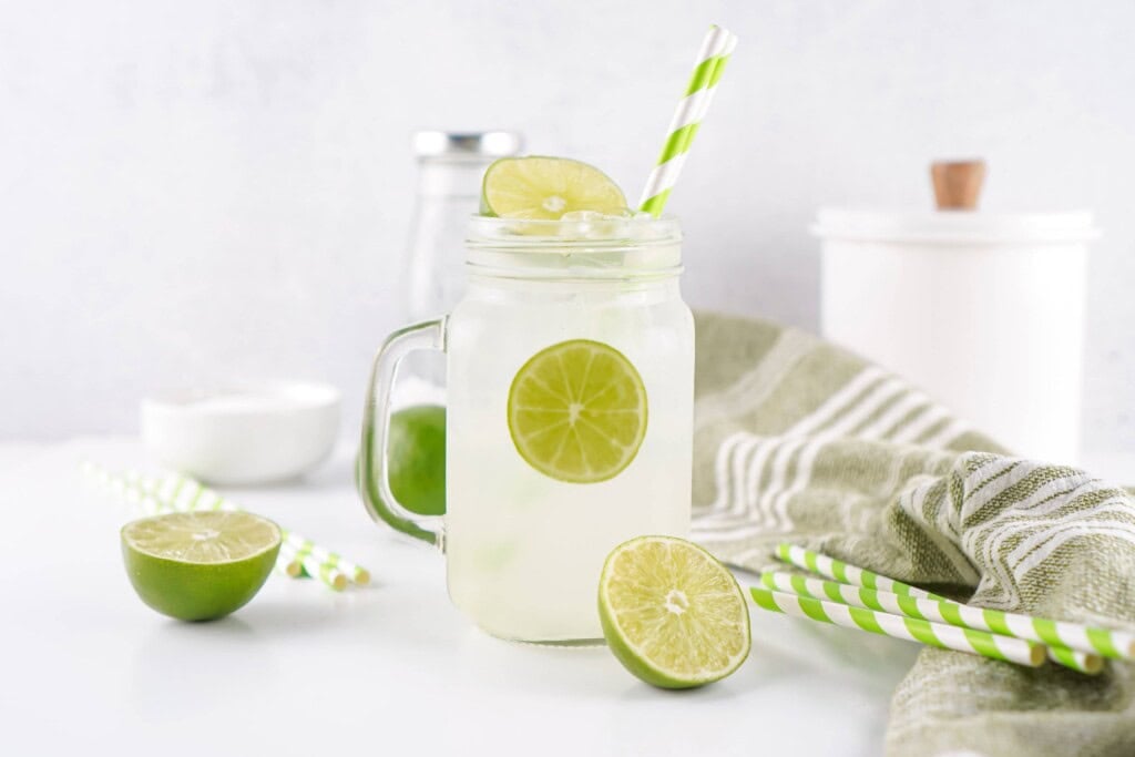 Headon photo of limeade in a mug.