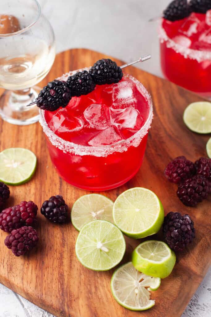Blackberry Margarita with fresh blackberries and lime slices.