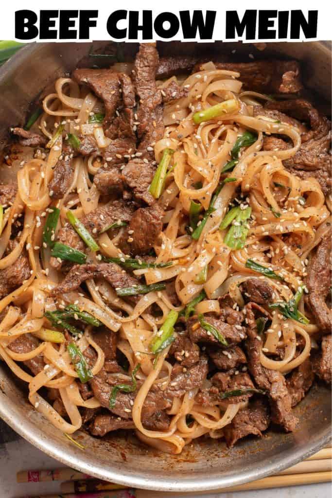 Overhead view of Beef Chow Mein in a skillet with Beef Chow Mein Title Overlay. 
