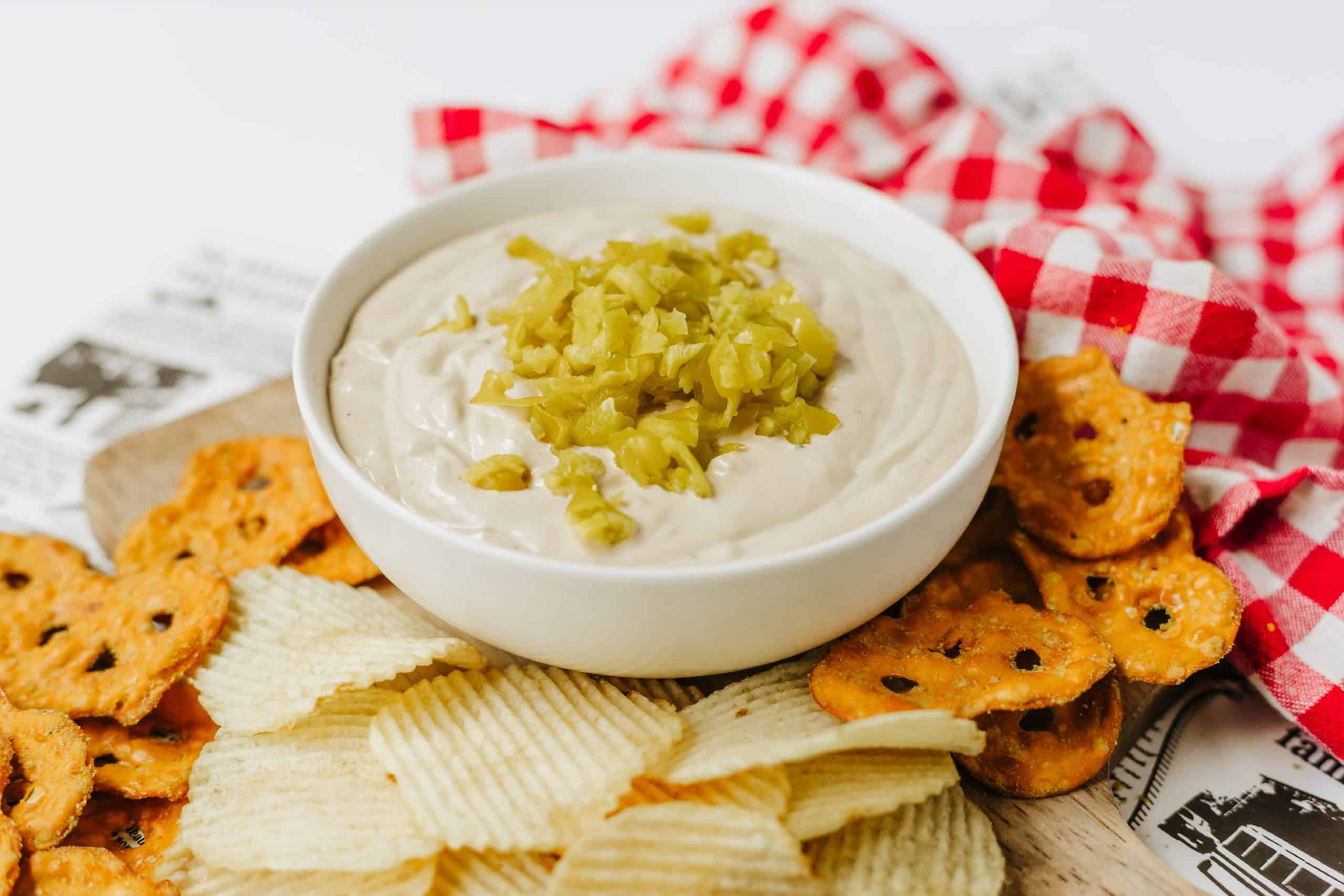 Bowl of Pot Roast Dip with chips and pretzels.