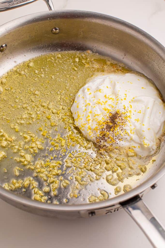 Overhead view of Greek yogurt lemon pasta sauce in an Iron Clad pan.