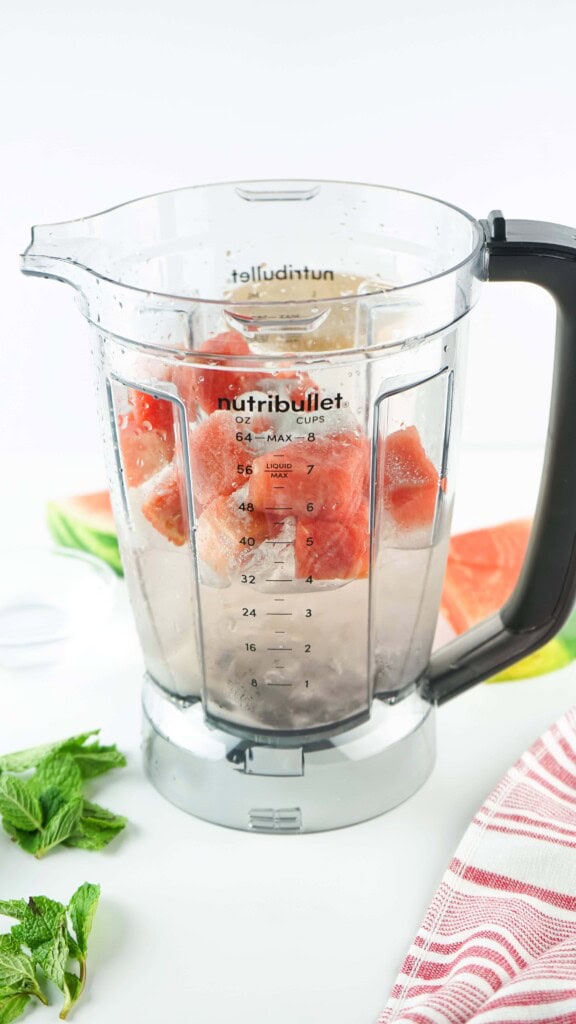 Headon view of watermelon Agua Fresca ingredients in a blender.
