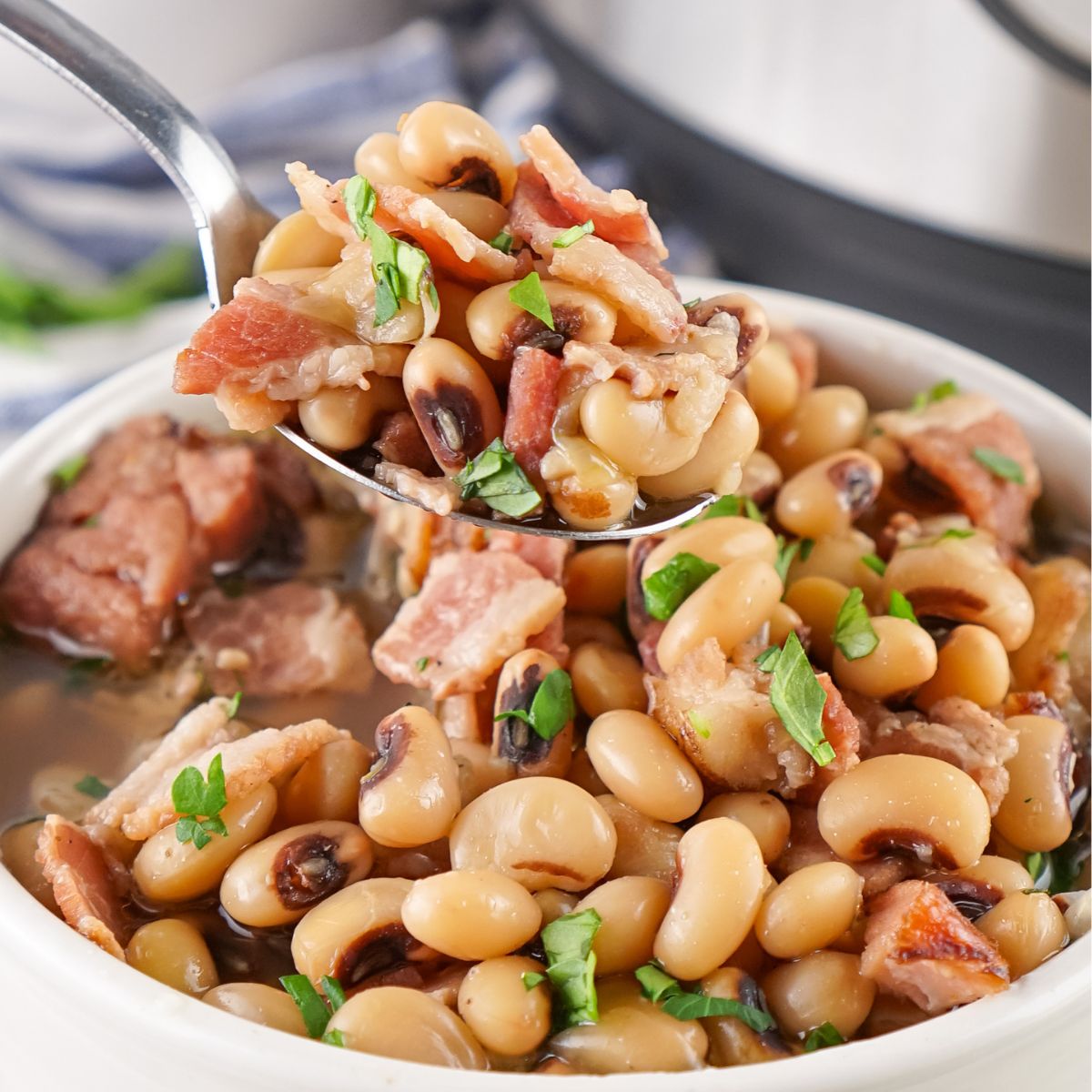 Instant Pot Black Eyed Peas in a bowl with a spoonful of them.