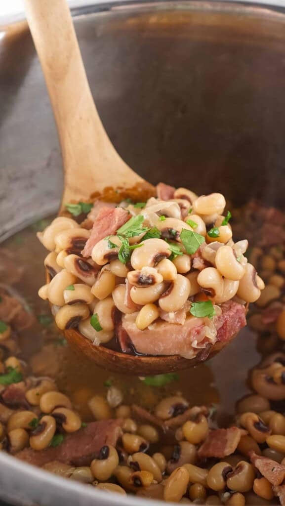 Ladle of Instant Pot Black Eyed Peas.