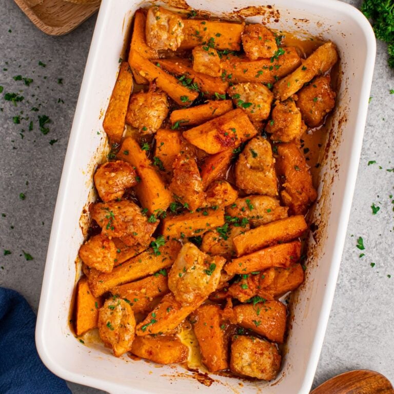Overhead view of sweet potato chicken bake in a white casserole dish.