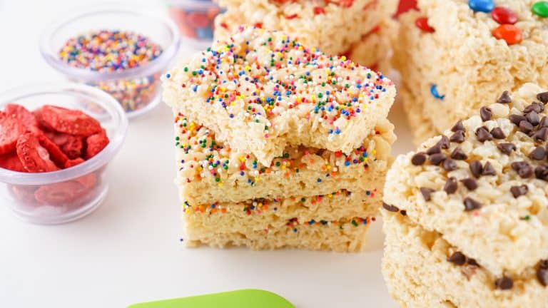 Head-on photo of Rice Krispies Treats bars with multi-coloredcsprinkles on them