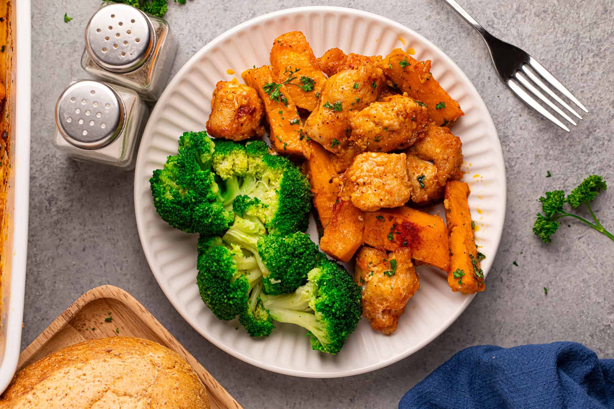 Overhead view of chicken, sweet potatoes and broccoli.