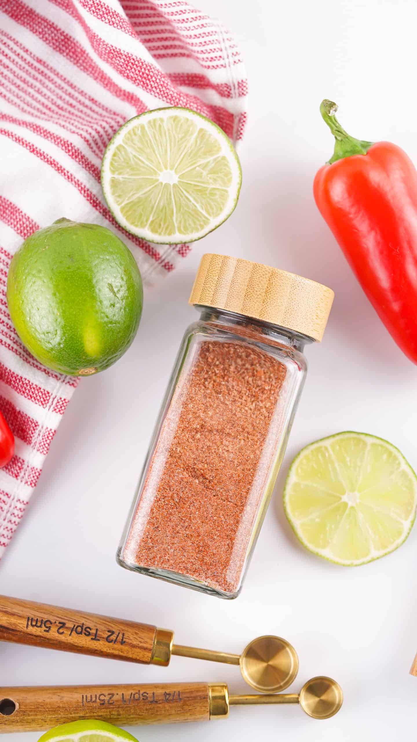 Overhead view of Tajin seasoning in a glass spice bottle