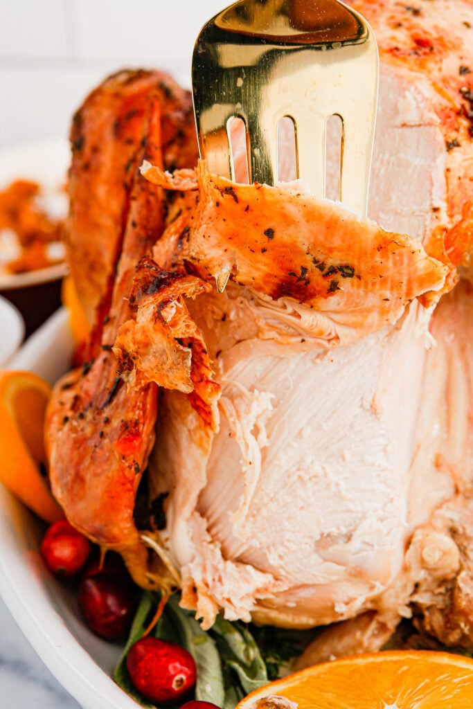Carve turkey with a fork in it.
