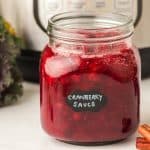 Instant Pot Cranberry sauce in glass jar.