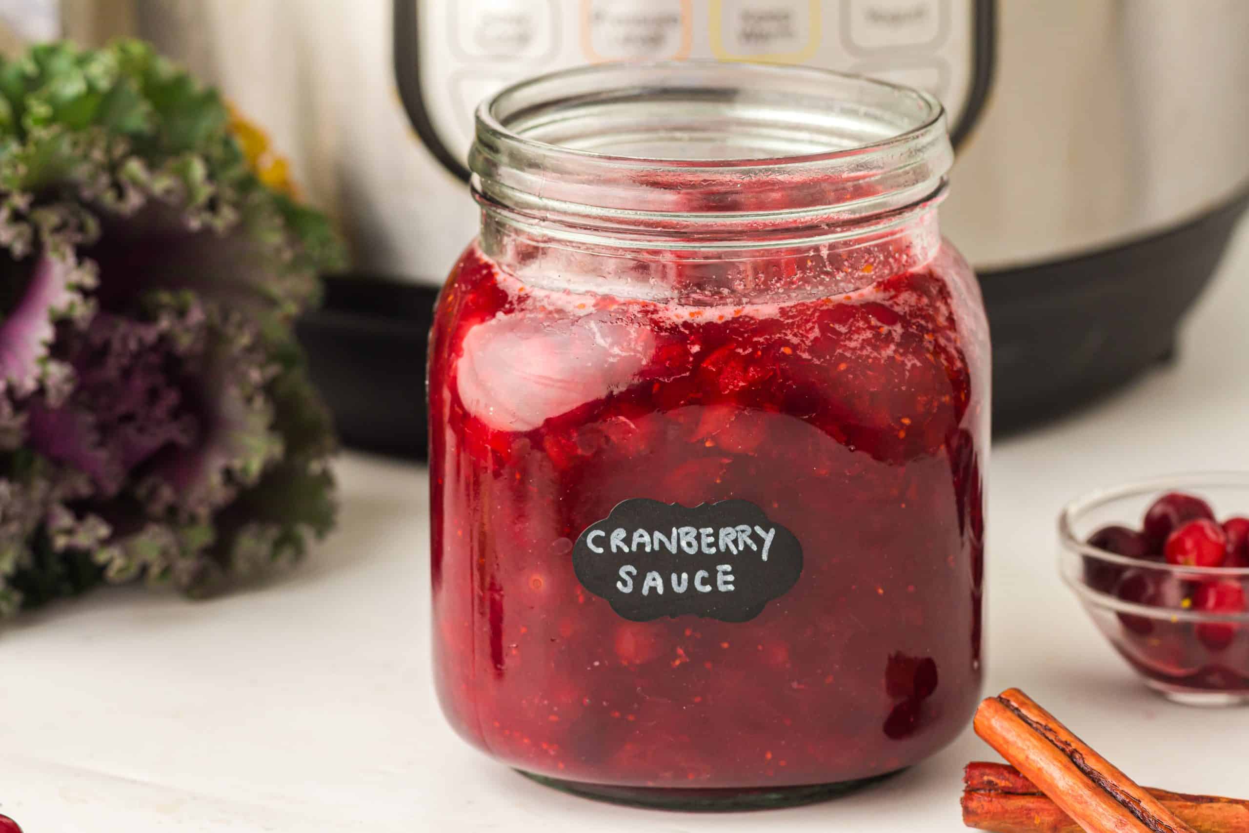 Instant Pot Cranberry sauce in glass jar.