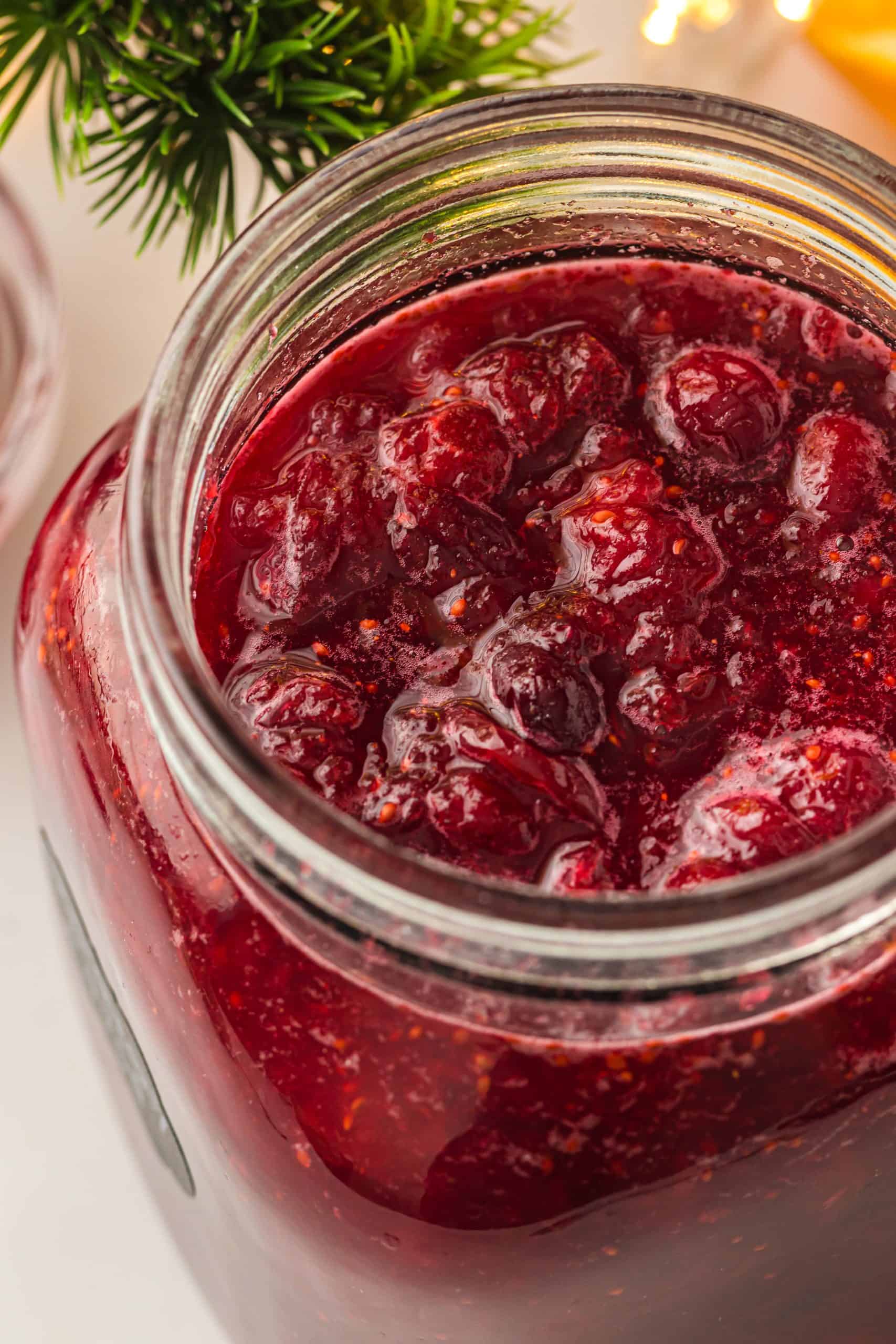 Overhead view cranberry sauce glass jar.