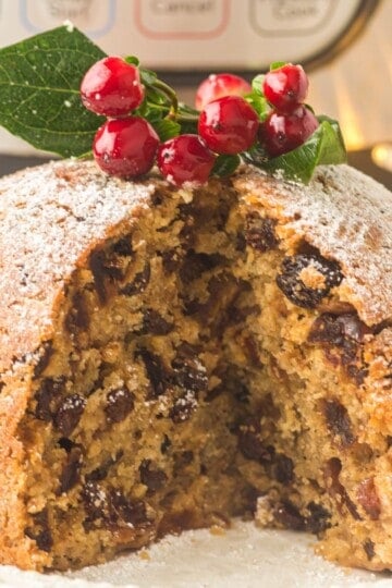 Fig pudding with a slice out of it.