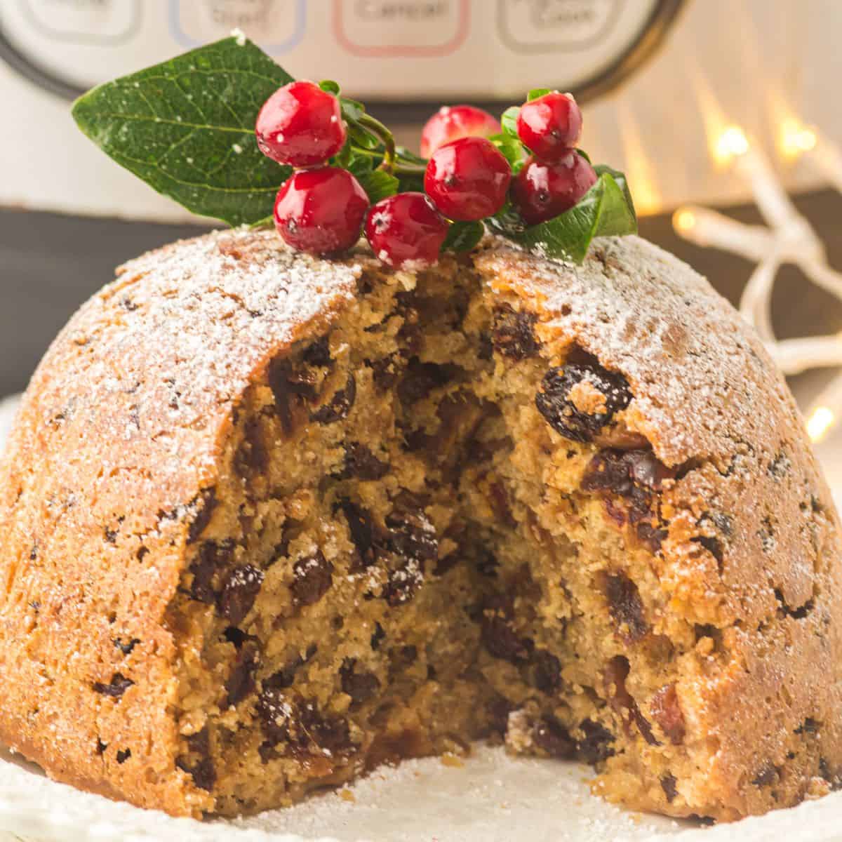 Fig pudding with a slice out of it.