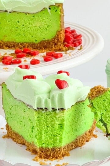 Slice of Grinch Christmas Cheesecake.
