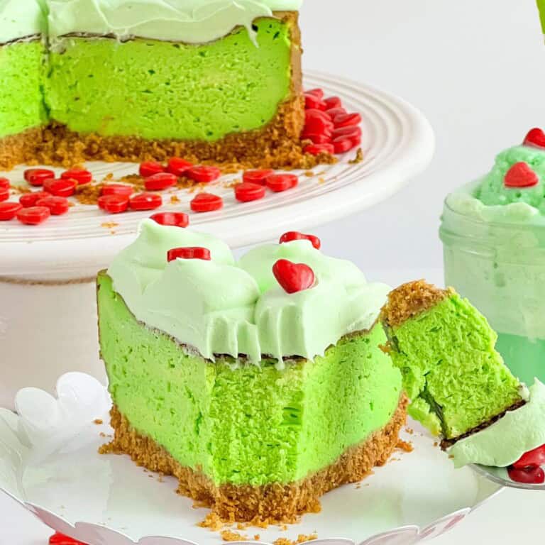 Slice of Grinch Christmas Cheesecake.