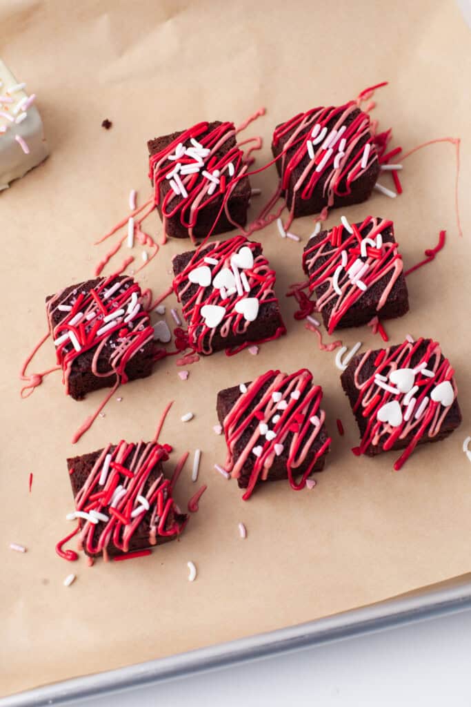 Brownies drizzled with chocolate.