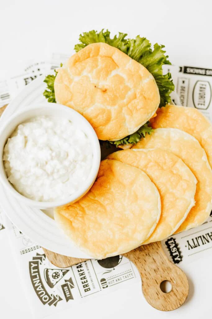 Cottage cheese cloud bread sandwich with extra rounds and cottage cheese arranged for storage