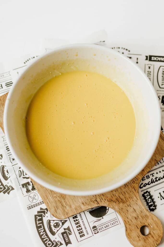 Smooth blended cottage cheese and egg yolk mixture in a white bowl