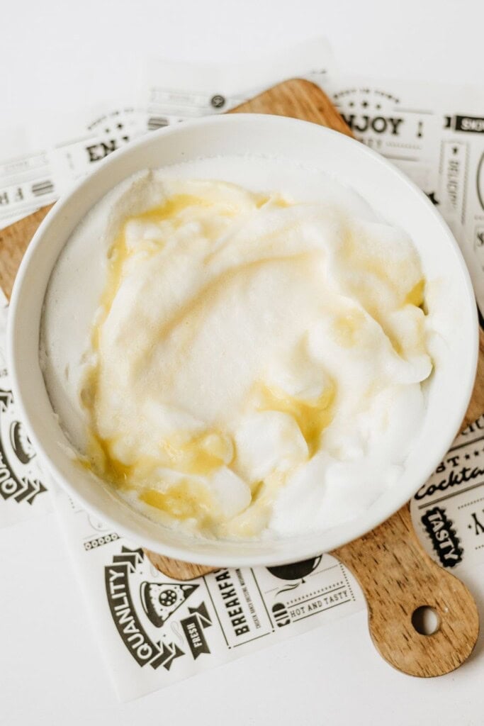 Cottage cheese yolk mixture being gently folded into whipped egg whites
