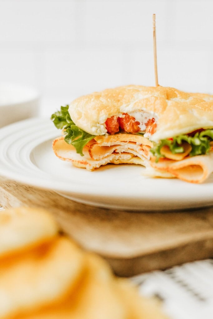 keto cottage cheese sandwich with a bite out of it.