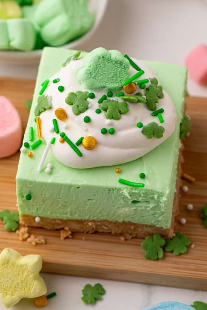 Mint cheesecake bars with Lucky Charms cereal marshmallows.