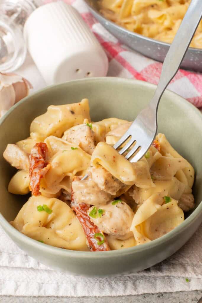 creamy chicken tortellini bowl fork