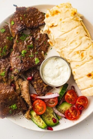 homemade doner kebab plated with yogurt sauce