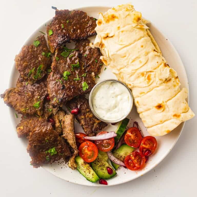 homemade doner kebab plated with yogurt sauce