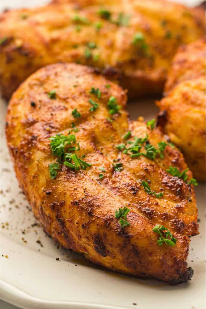 overhead view of air fryer chicken breast.