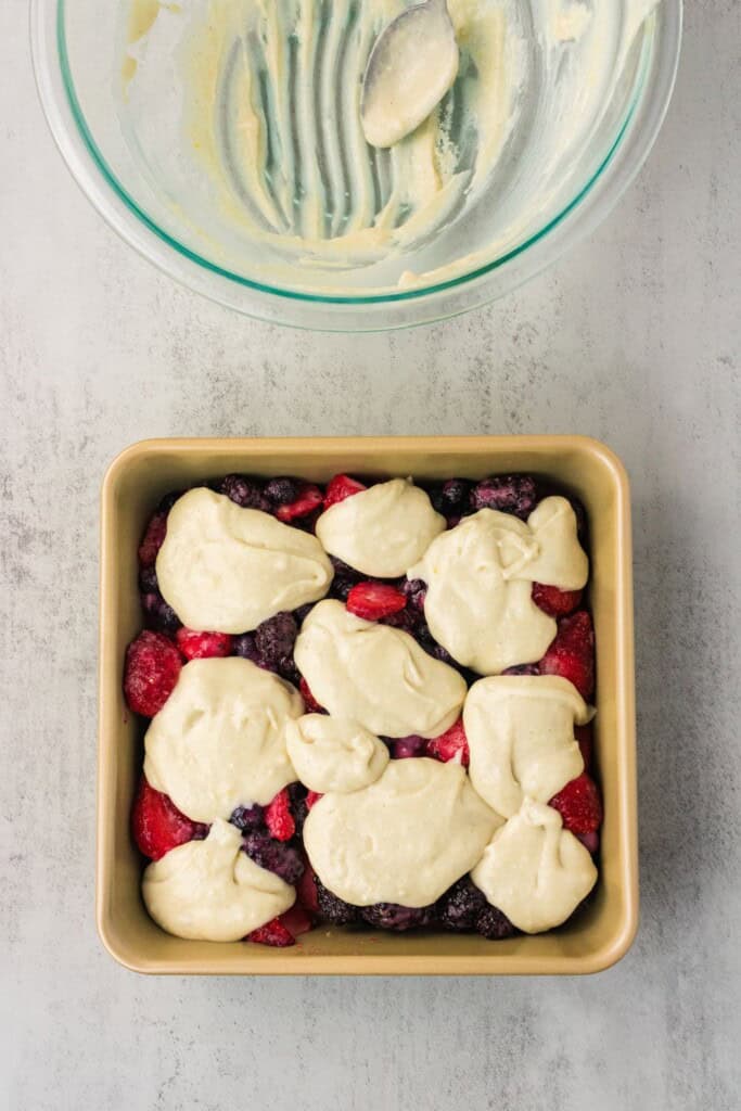 egan cobbler batter dolloped over the berry filling before baking