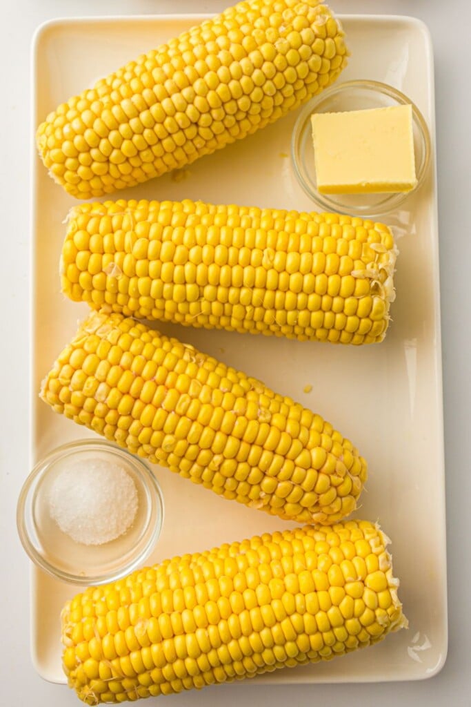 Overhead view of ingredients needed for corn on the cob cooked in the air fryer