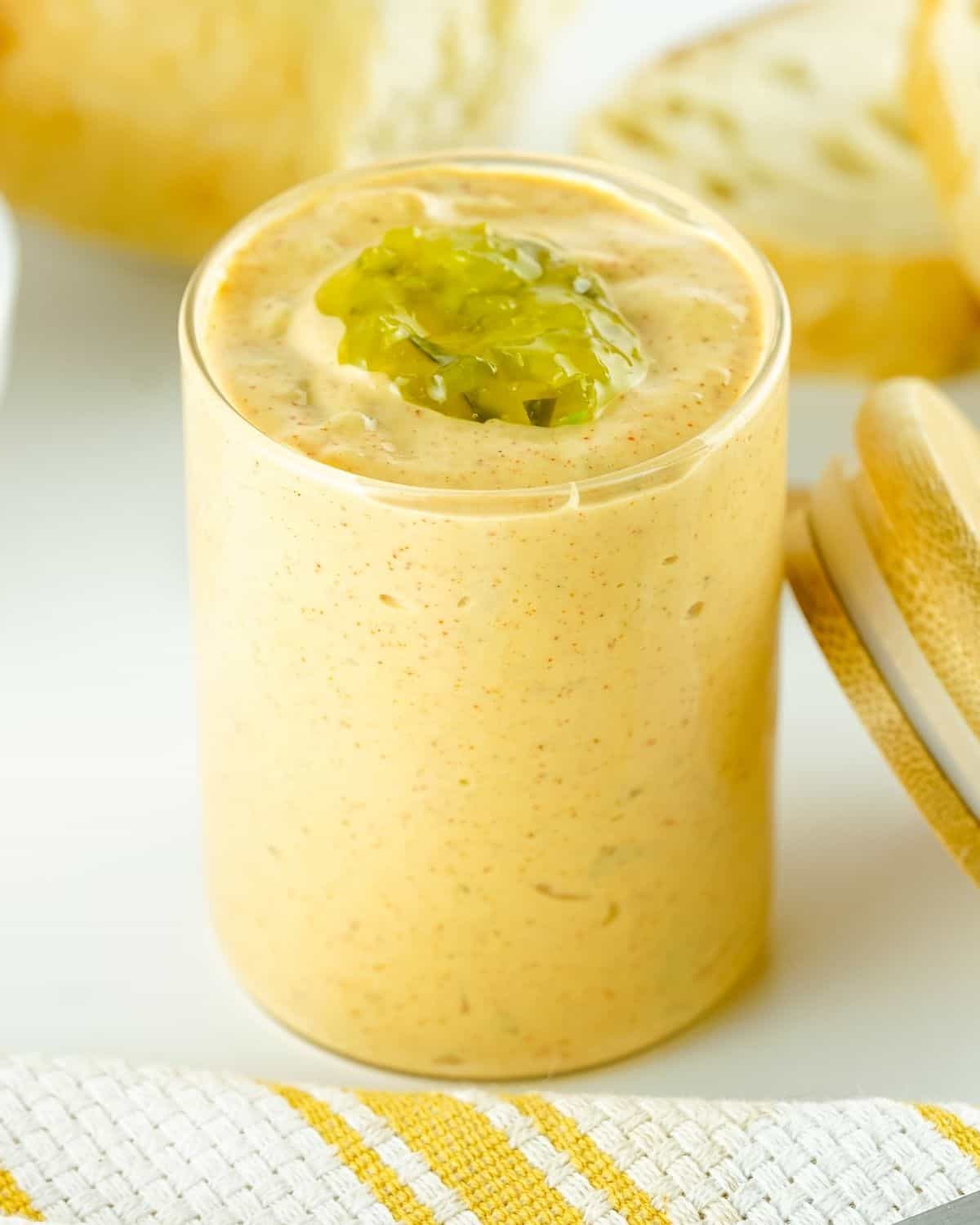 Jar of homemade Big Mac sauce topped with pickle relish
