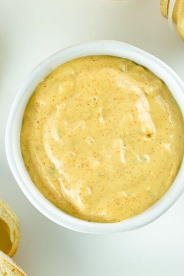 Overhead bowl of copycat Big Mac sauce with bread and pickle relish