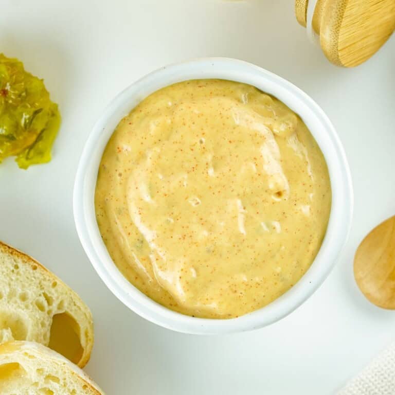 Overhead bowl of copycat Big Mac sauce with bread and pickle relish