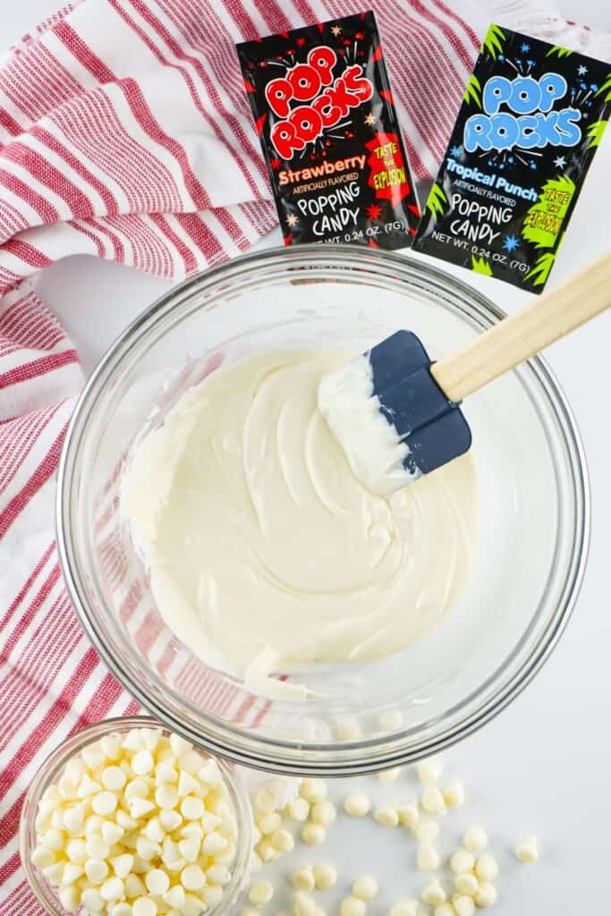 Smooth melted white chocolate in a glass bowl